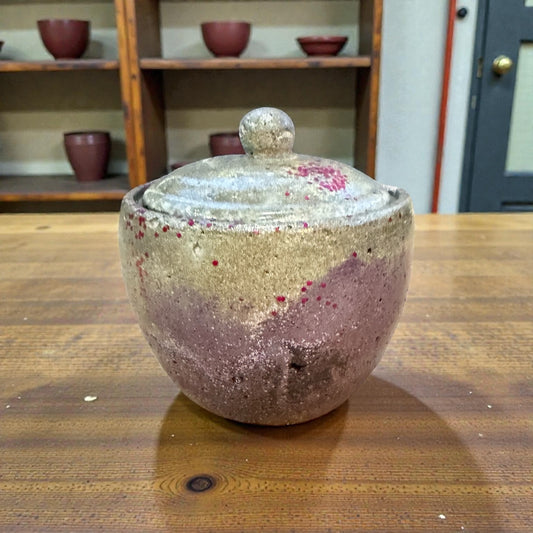 Hand-poured concrete storage jar with metallic sheen