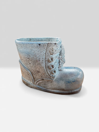 Hand-poured concrete boot planter with speckled blue tones