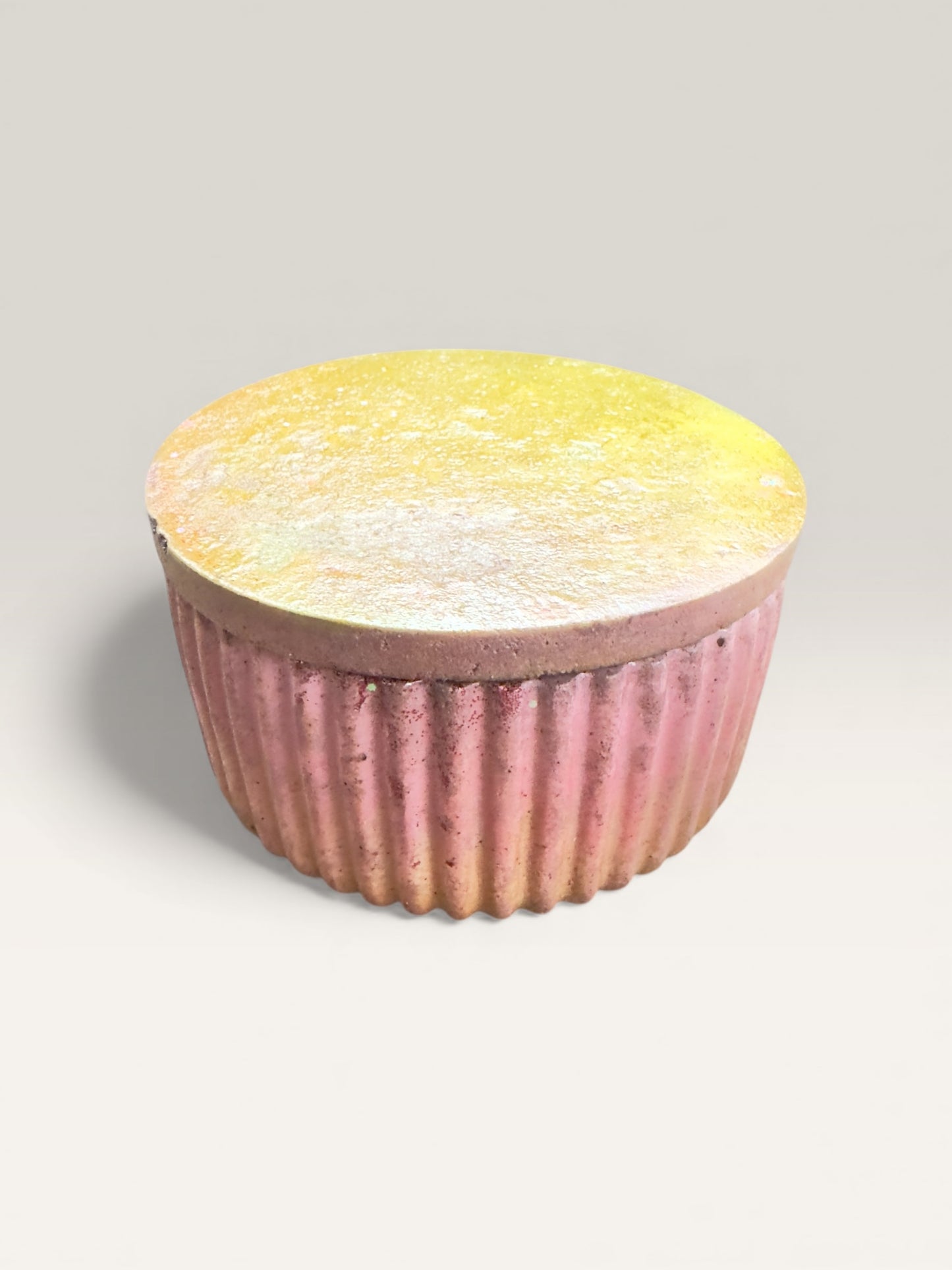 Hand-poured concrete storage jar with lid in yellow and pink tones