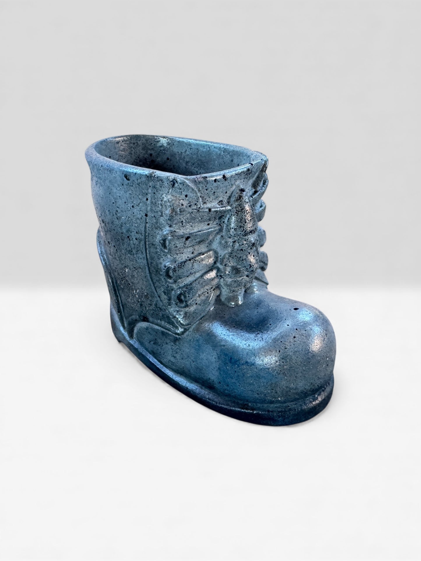 Handmade concrete boot planter in winter-inspired denim blue