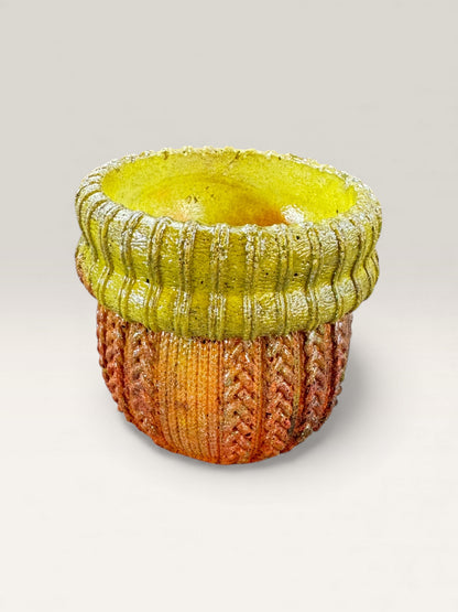 Handmade round concrete planter with cozy sweater-like pattern