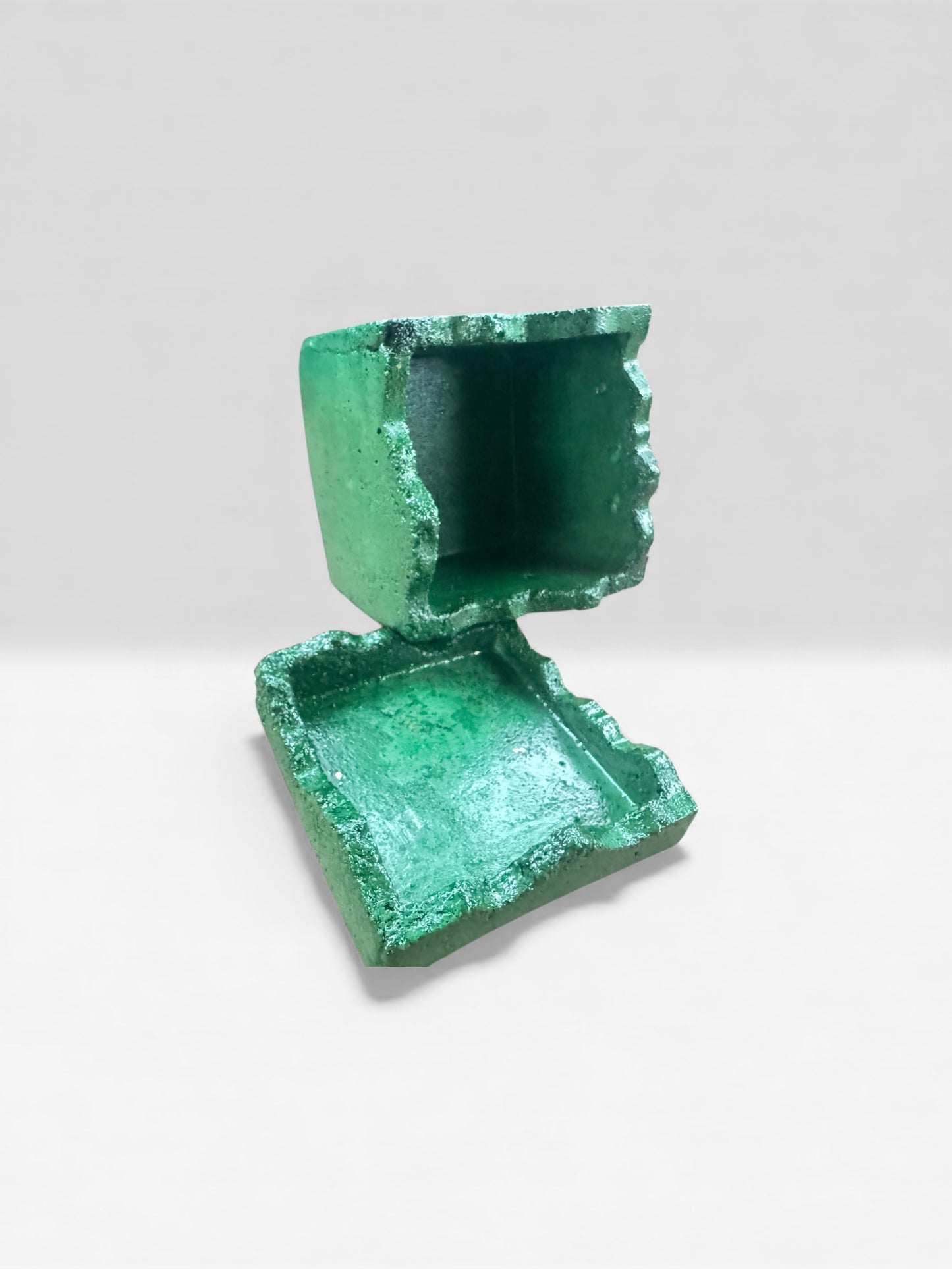Modern emerald green concrete storage jar with unique marbled texture