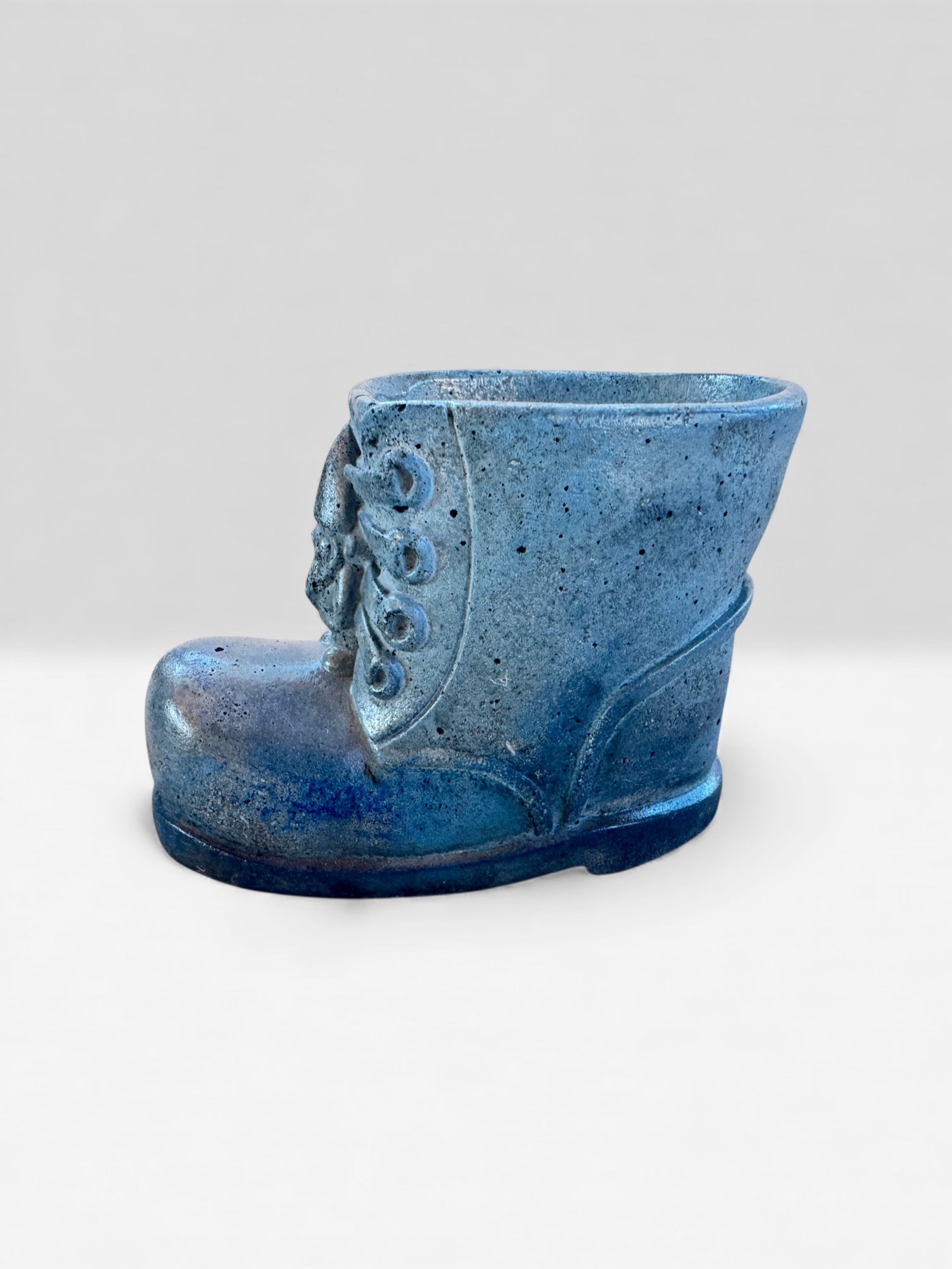 Small concrete boot planter for succulents or tiny plants