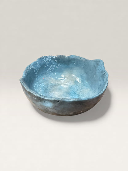 Soft blue concrete bowl with smooth stone-like surface