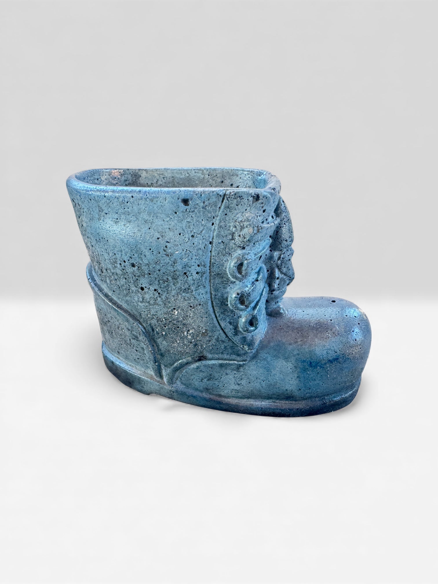 Unique concrete boot-shaped pot for holiday or seasonal decor