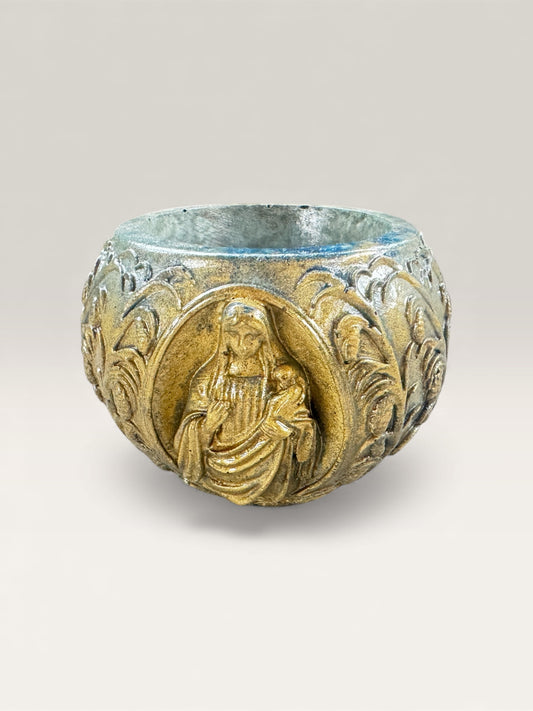 Violet-purple concrete vessel with Madonna relief motif